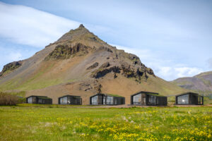 Arnastapi, Snaefellsness, Western Iceland, June 27, 2020: Mountain and modern summer cabins